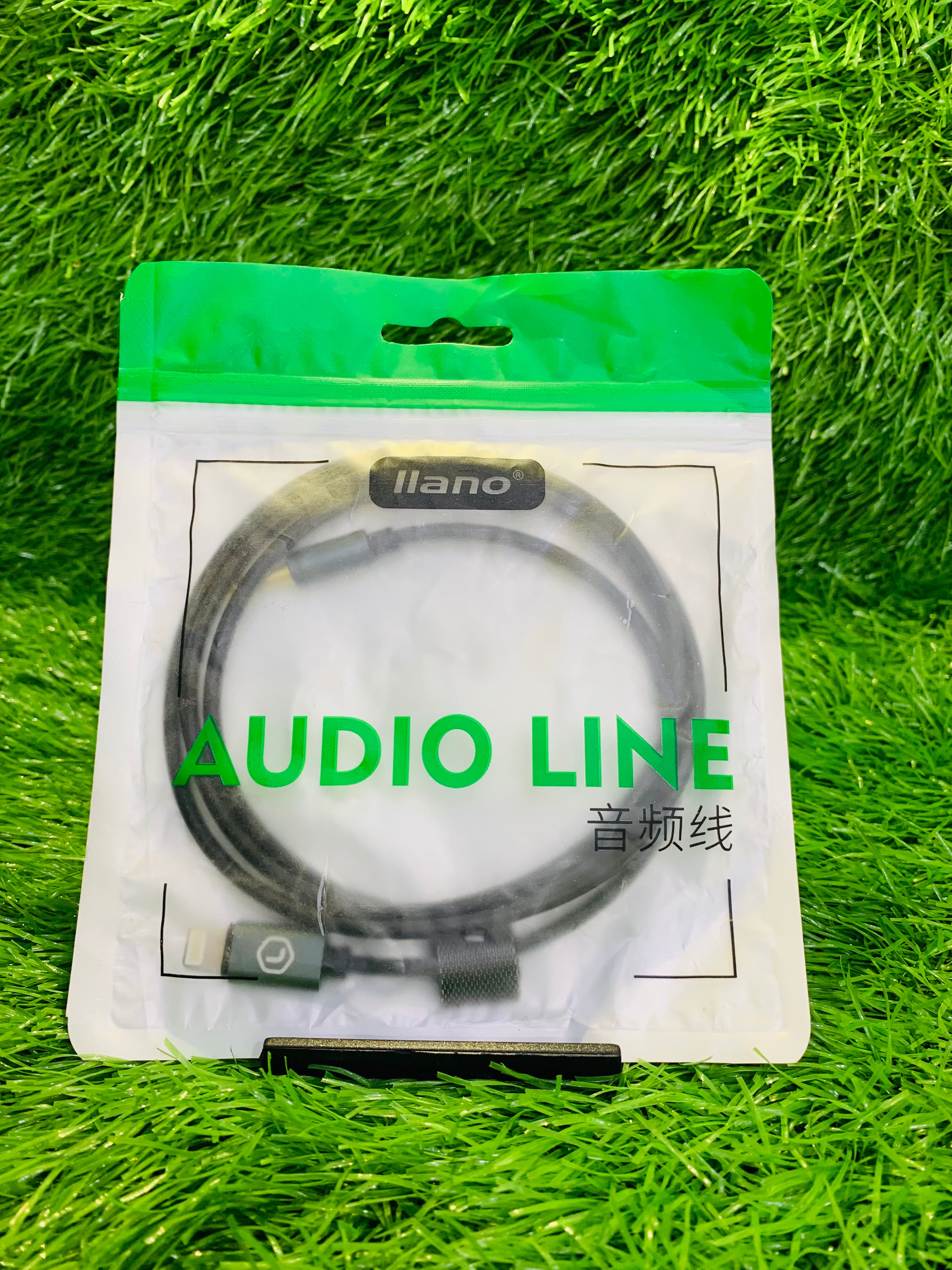Audio line on a white card with green border against a grass background